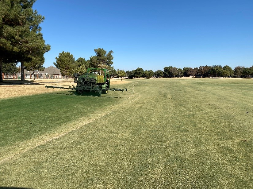spraying dormant green on a golf course